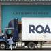 A driver climbs into the cab of his semi parked in front of Anthropologie in Arbor Hills shopping center on Washtenaw Ave. on Thursday, August 8, 2013. Melanie Maxwell | AnnArbor.com